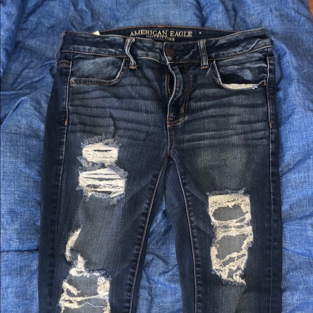 Ripped blue jeans.